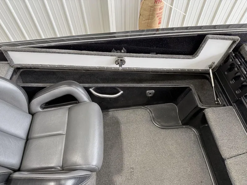 Slide: The Image of 2021 Phoenix 721 ProXP boat interior with gray seating and storage compartment. - 14