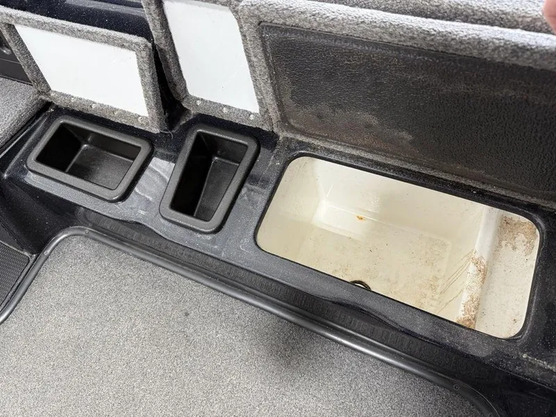 Slide: The Image of Storage compartments in a 2021 Phoenix 721 ProXP boat interior. - 15