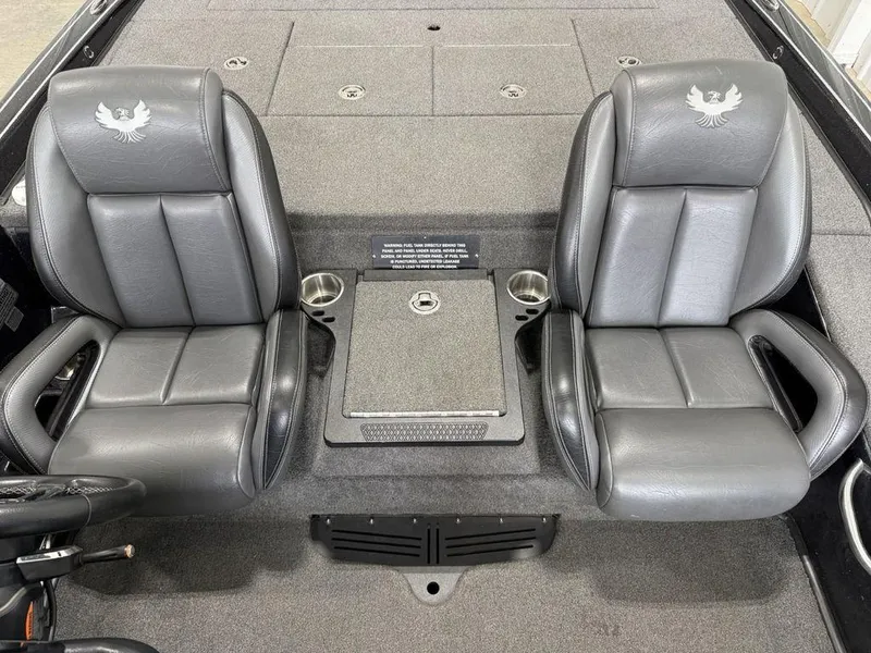 Slide: The Image of 2021 Phoenix 721 ProXP boat interior with dual gray seats and storage compartment. - 16