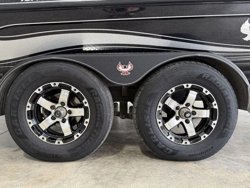 Slide: The Image of 2021 Phoenix 721 ProXP trailer wheels with stylish rims and logo detail. - 26