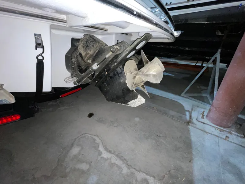Slide: The Image of 2017 Chaparral 287 SSX boat propeller and stern drive in a garage setting. - 11