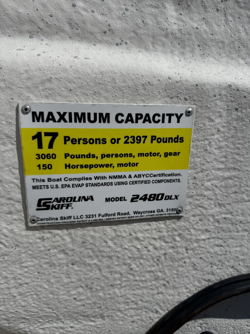 Slide: The Image of 2017 Carolina Skiff 24 DLX capacity plate: 17 persons, 2397 pounds, 150 horsepower. - 15