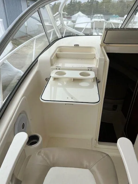 Slide: The Image of 2006 Scout 262 Abaco boat interior with cup holders and seating area. - 15