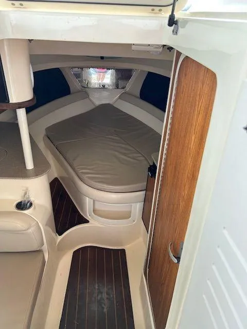 Slide: The Image of 2006 Scout 262 Abaco cabin interior with bed, wood accents, and modern design. - 22