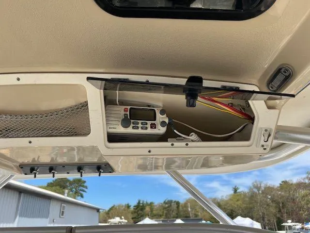 Slide: The Image of 2006 Scout 262 Abaco boat console with radio and wiring compartment. - 8
