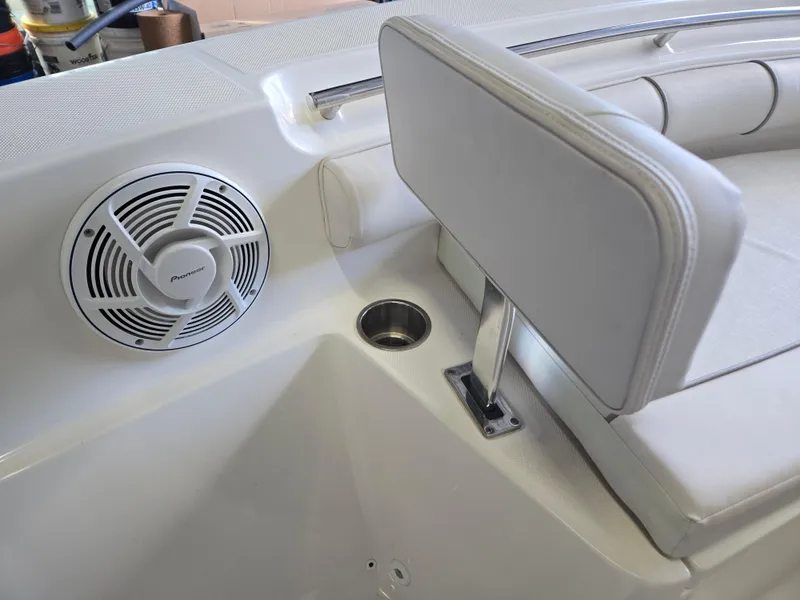 Slide: The Image of 2021 Sea Born LX22 Center Console boat interior with speaker and seating. - 20