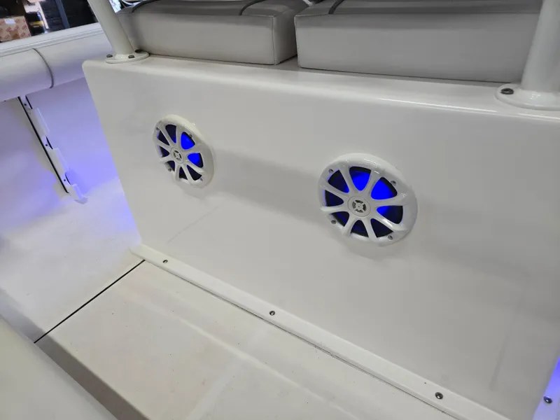 Slide: The Image of 2021 Sea Born LX22 Center Console boat with illuminated speakers on deck. - 25