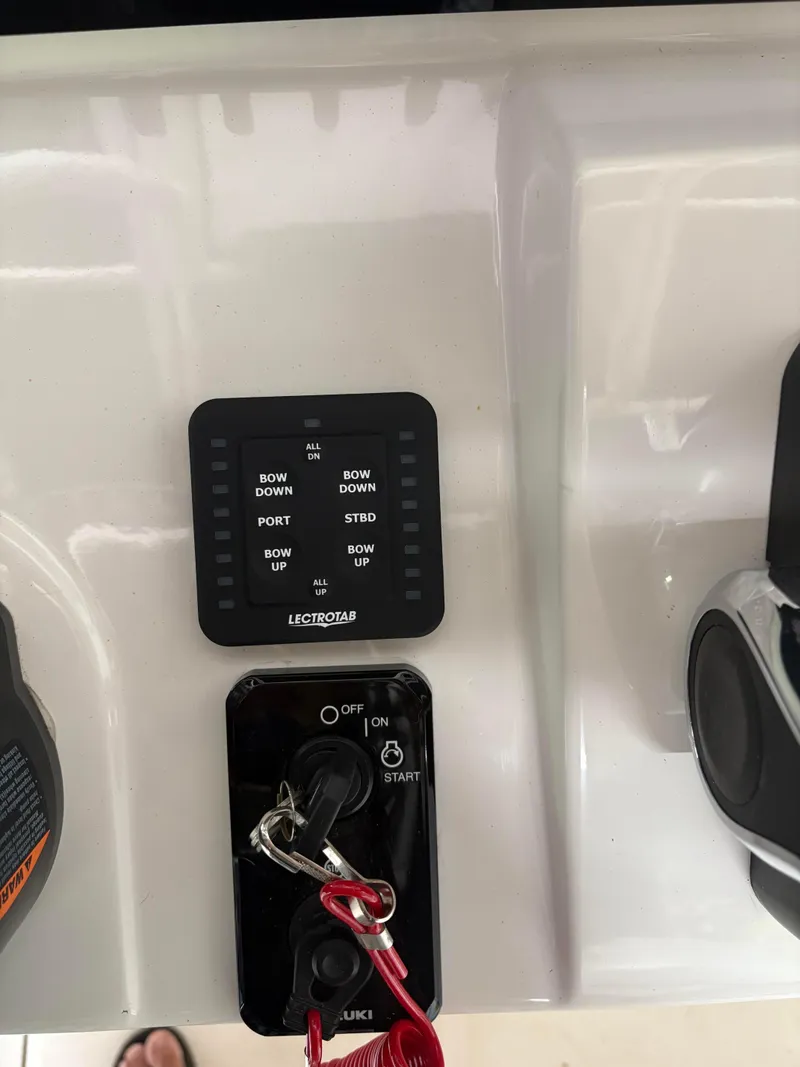 Slide: The Image of 2021 Sea Born LX22 Center Console boat controls with Lectrotab trim tab panel. - 26