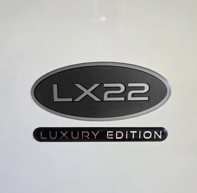 Slide: The Image of 2021 Sea Born LX22 Center Console Luxury Edition emblem. - 31