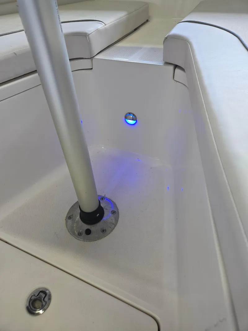 Slide: The Image of 2021 Sea Born LX22 Center Console boat interior with blue LED light. - 37