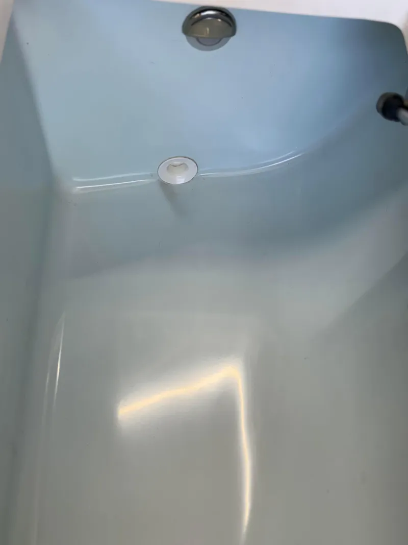 Slide: The Image of 2021 Sea Born LX22 Center Console boat interior detail, featuring a sleek, smooth surface. - 38