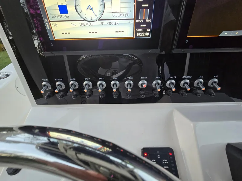 Slide: The Image of 2021 Sea Born LX22 Center Console dashboard with control switches and display screens. - 41