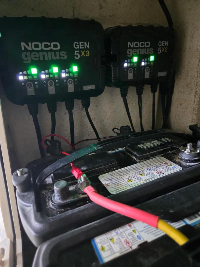 Slide: The Image of NOCO Genius chargers connected to a battery in a 2021 Sea Born LX22 Center Console boat. - 45