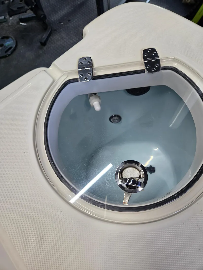 Slide: The Image of 2021 Sea Born LX22 Center Console livewell with clear lid and stainless steel latch. - 46