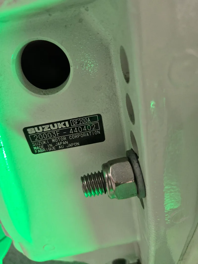 Slide: The Image of Close-up of Suzuki motor part on 2021 Sea Born LX22 Center Console boat. - 6