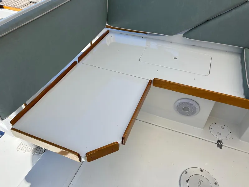 Slide: The Image of 1986 Dyer 29 Trunk Cabin interior with seating and storage compartments. - 20