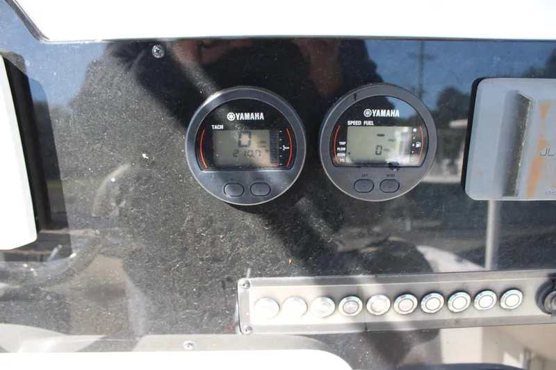 Slide: The Image of Yamaha gauges on 2019 Tidewater 210 CC Adventure boat dashboard. - 15