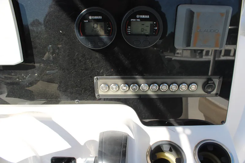 Slide: The Image of Control panel of 2019 Tidewater 210 CC Adventure boat with Yamaha gauges and switches. - 17