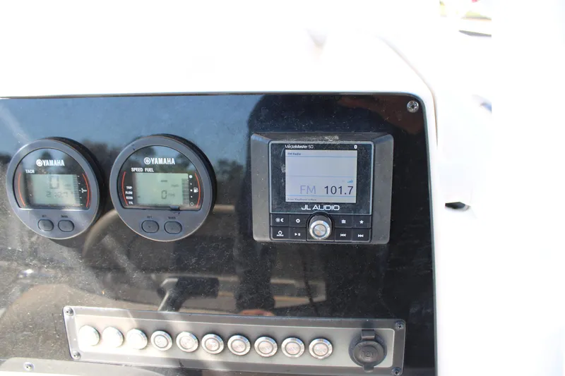 Slide: The Image of 2019 Tidewater 210 CC Adventure dashboard with Yamaha gauges and JL Audio system. - 18