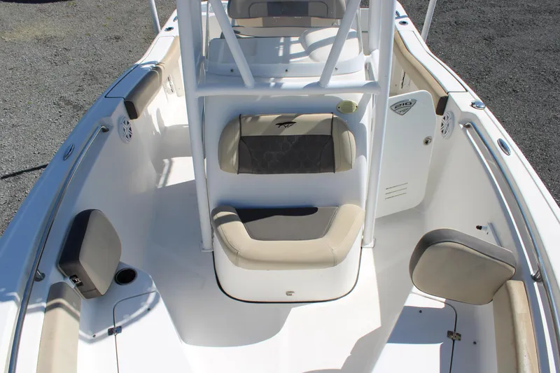Slide: The Image of 2019 Tidewater 210 CC Adventure boat interior with seating and console. - 21