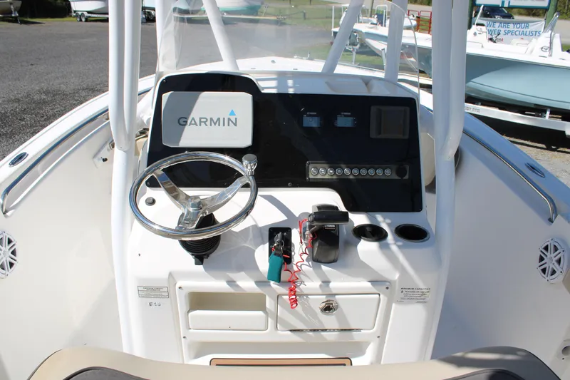 Slide: The Image of 2019 Tidewater 210 CC Adventure boat console with Garmin navigation system and steering wheel. - 22