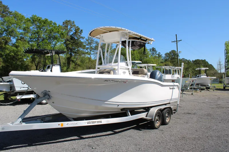 Slide: The Image of 2019 Tidewater 210 CC Adventure boat on trailer, parked outdoors. - 25