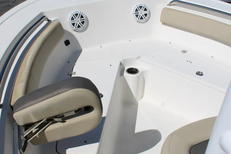 Slide: The Image of 2019 Tidewater 210 CC Adventure boat interior with cushioned seating and cup holder. - 28