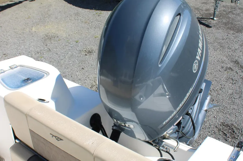 Slide: The Image of 2019 Tidewater 210 CC Adventure boat with Yamaha outboard motor, rear seating, and livewell. - 30
