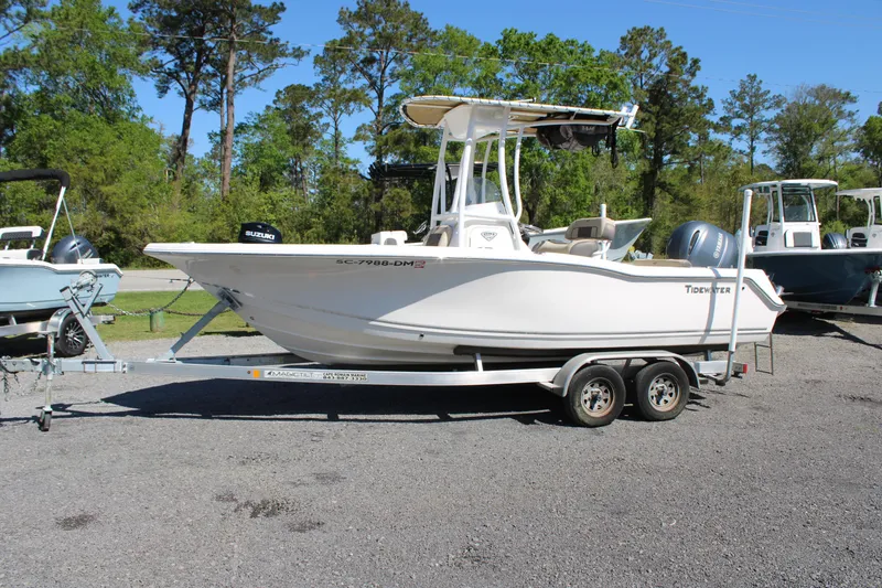 Slide: The Image of 2019 Tidewater 210 CC Adventure boat on trailer, parked outdoors. - 4