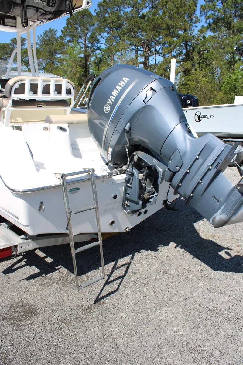 Slide: The Image of 2019 Tidewater 210 CC Adventure boat with Yamaha outboard motor, parked on gravel. - 6