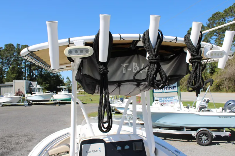 Slide: The Image of 2019 Tidewater 210 CC Adventure boat with T-top, rod holders, and Garmin electronics. - 8