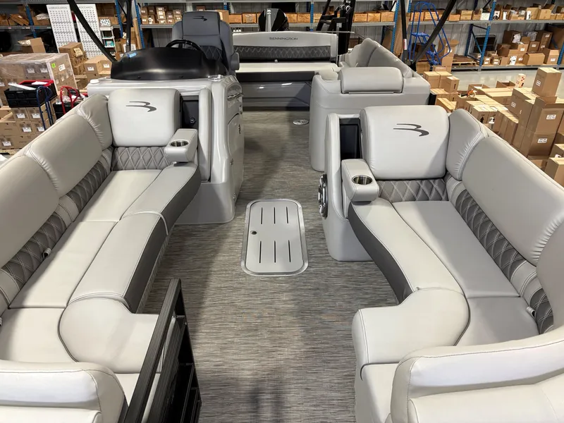 Slide: The Image of 2022 Bennington 25 QSBSG pontoon boat interior with luxurious seating and modern design. - 4