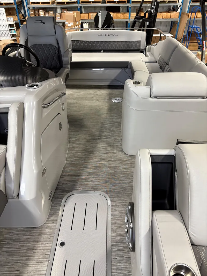 Slide: The Image of 2022 Bennington 25 QSBSG pontoon boat interior with luxurious seating and modern design. - 5