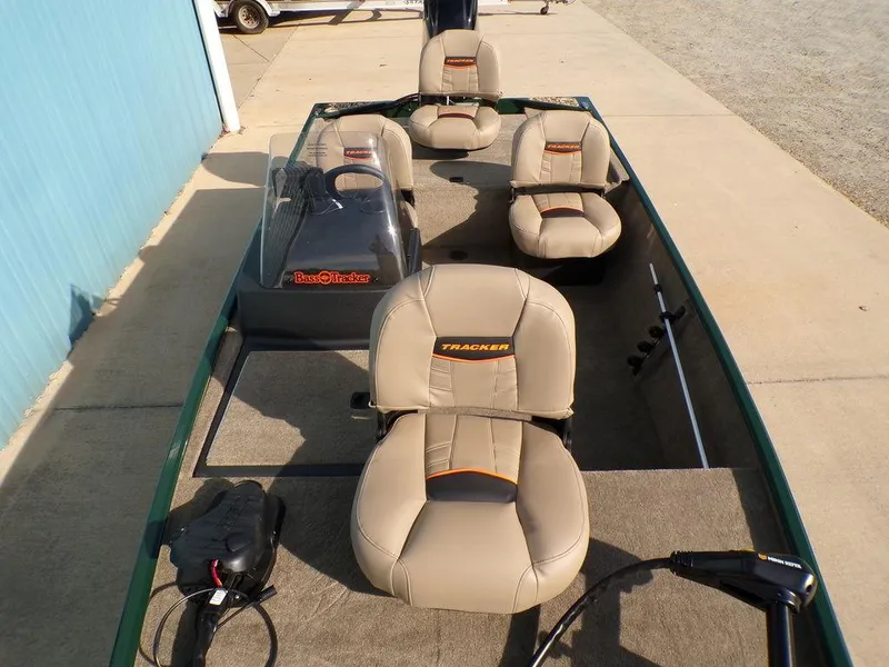Slide: The Image of 2025 Tracker Bass Tracker® Classic Limited boat with beige seating and steering console. - 11