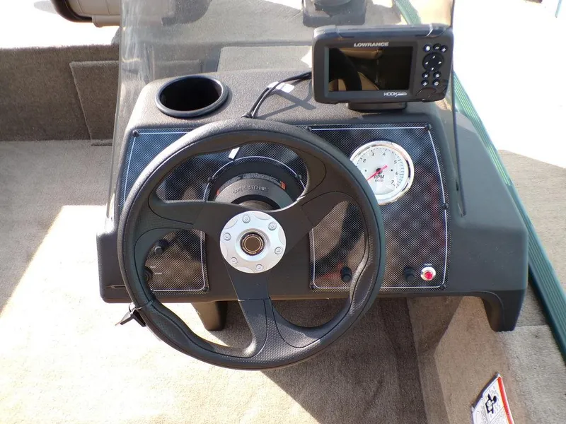 Slide: The Image of 2025 Tracker Bass Tracker® Classic Limited dashboard with steering wheel and fish finder. - 13