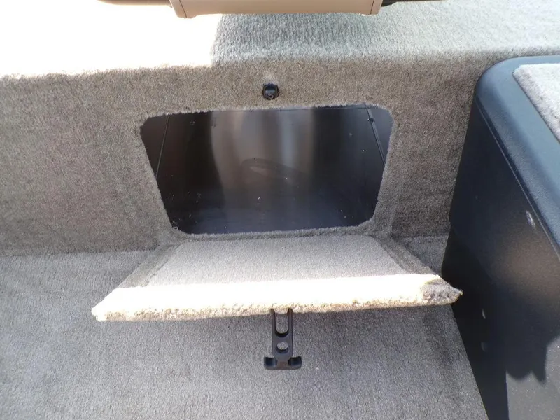 Slide: The Image of 2025 Tracker Bass Tracker® Classic Limited storage compartment with open hatch. - 17