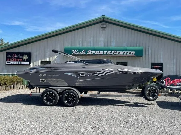 Slide: The Image of 2023 Crownline 220 SS LPX boat on trailer at Mack's Sports Center. - 1