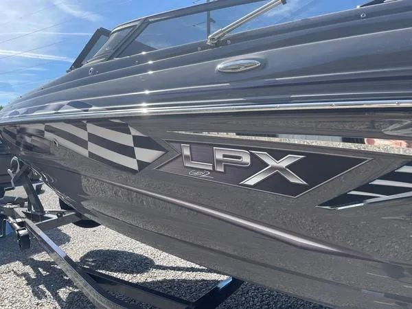 Slide: The Image of 2023 Crownline 220 SS LPX boat with sleek design and LPX branding. - 3