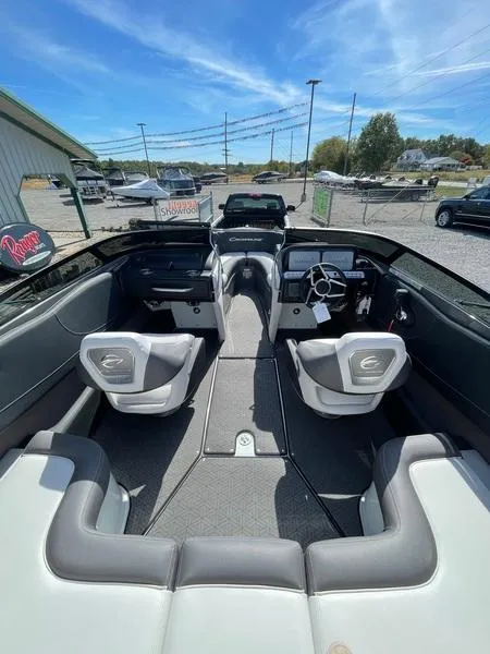 Slide: The Image of 2023 Crownline 220 SS LPX boat interior with sleek seating and modern dashboard. - 5