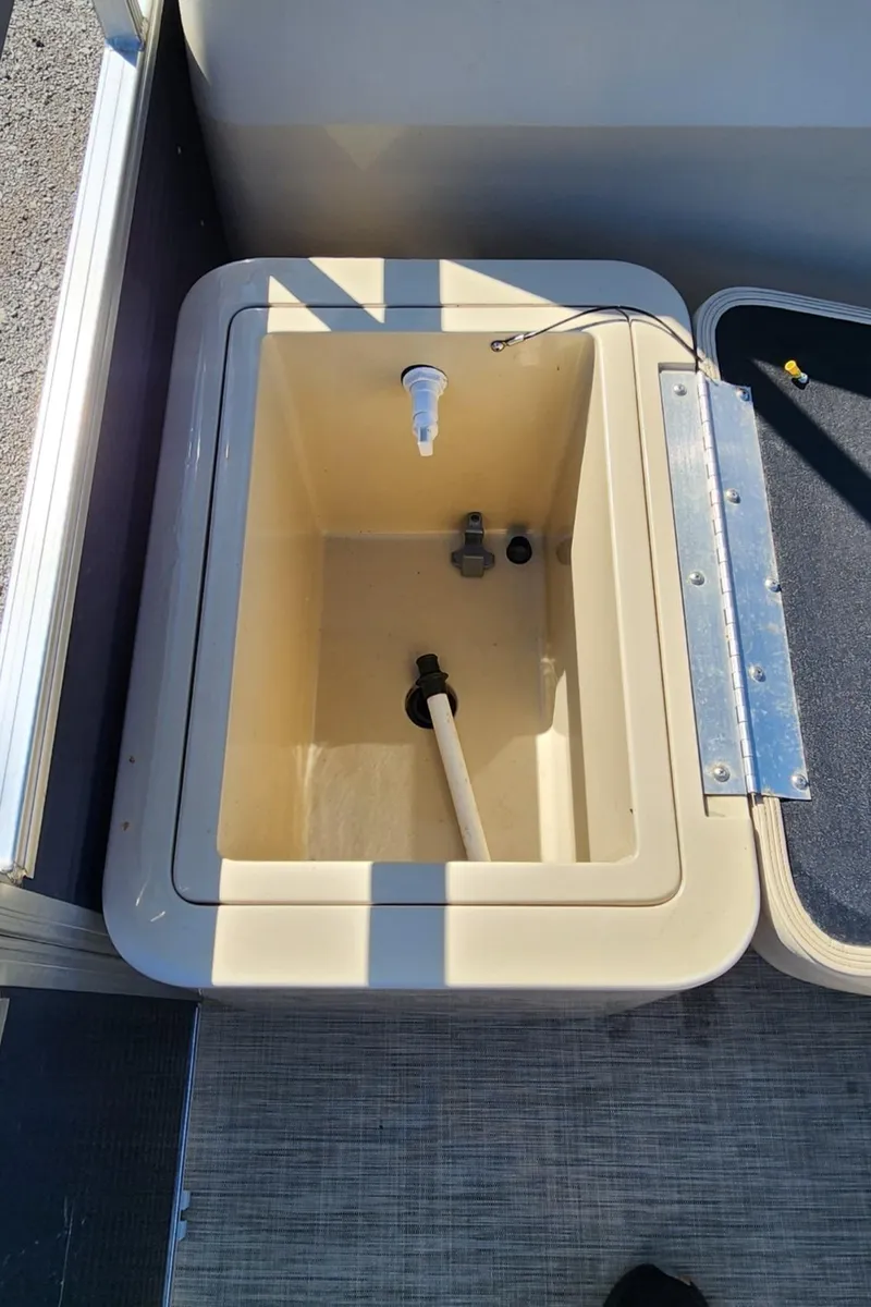 Slide: The Image of 2015 Landau A'Lure 212 Fishing boat livewell with open lid, showing interior features. - 11