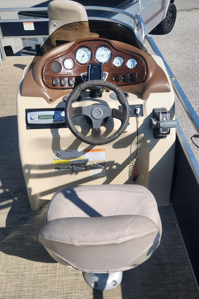 Slide: The Image of 2015 Landau A'Lure 212 Fishing boat dashboard with steering wheel and controls. - 7