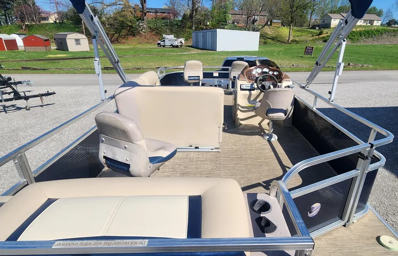 Slide: The Image of 2015 Landau A'Lure 212 Fishing boat with beige seating and steering console. - 9