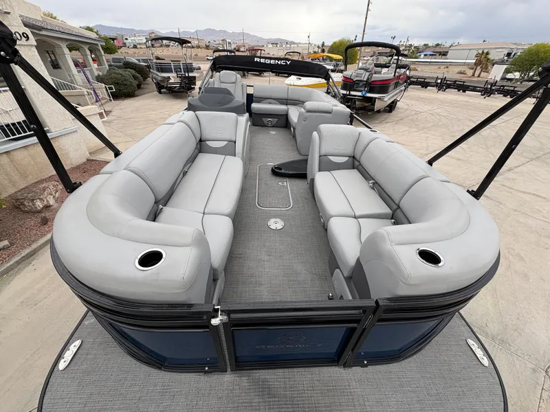 Slide: The Image of 2019 Regency 210 DL3 pontoon boat with spacious seating and modern design. - 5