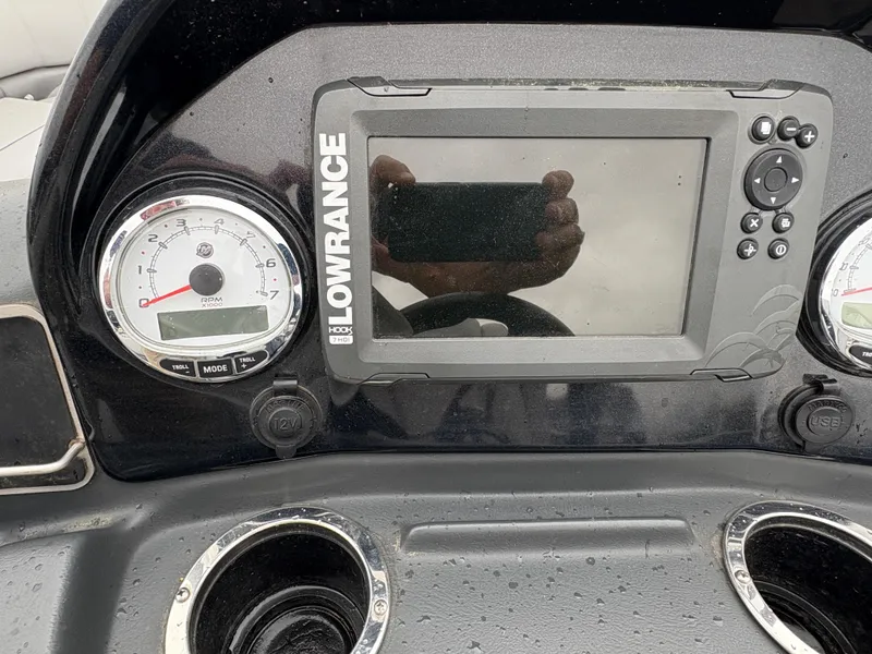 Slide: The Image of Dashboard of a 2019 Regency 210 DL3 boat with Lowrance display and gauges. - 8