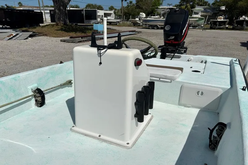 Slide: The Image of 1999 BAYCRAFT 18 SKIFF boat interior with steering console and outboard motor. - 7