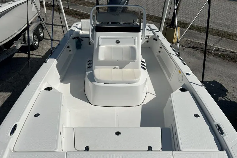 Slide: The Image of 2020 Frontier 2104 CC boat interior with seating and storage compartments. - 13