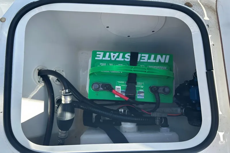 Slide: The Image of Battery compartment of a 2020 Frontier 2104 CC boat with Interstate battery. - 15