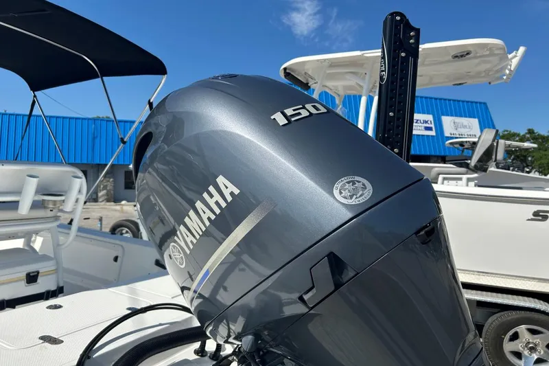 Slide: The Image of Yamaha 150 outboard motor on a 2020 Frontier 2104 CC boat, sunny day. - 17