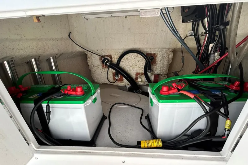 Slide: The Image of Battery compartment of a 2020 Frontier 2104 CC boat with wiring and connections. - 20