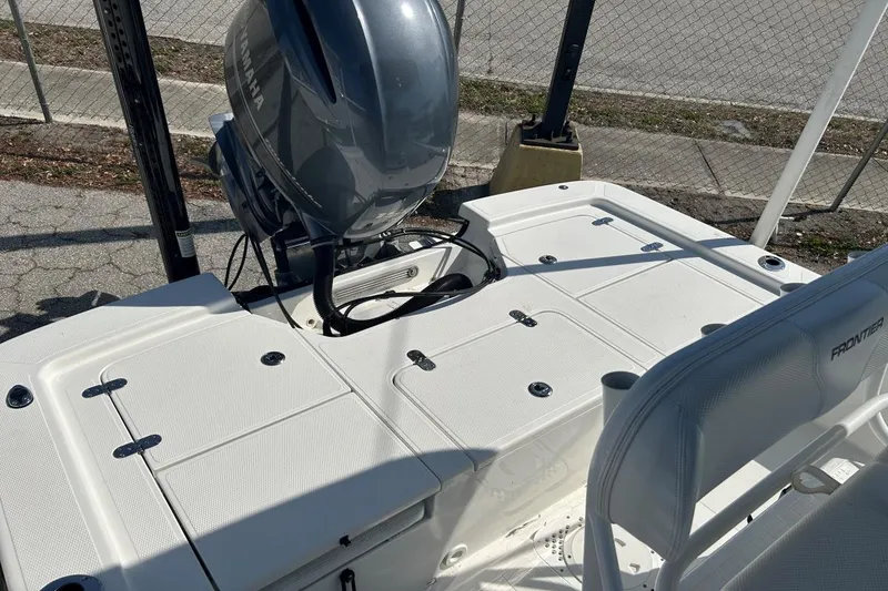 Slide: The Image of 2020 Frontier 2104 CC boat with Yamaha outboard motor, white deck, and seating. - 3
